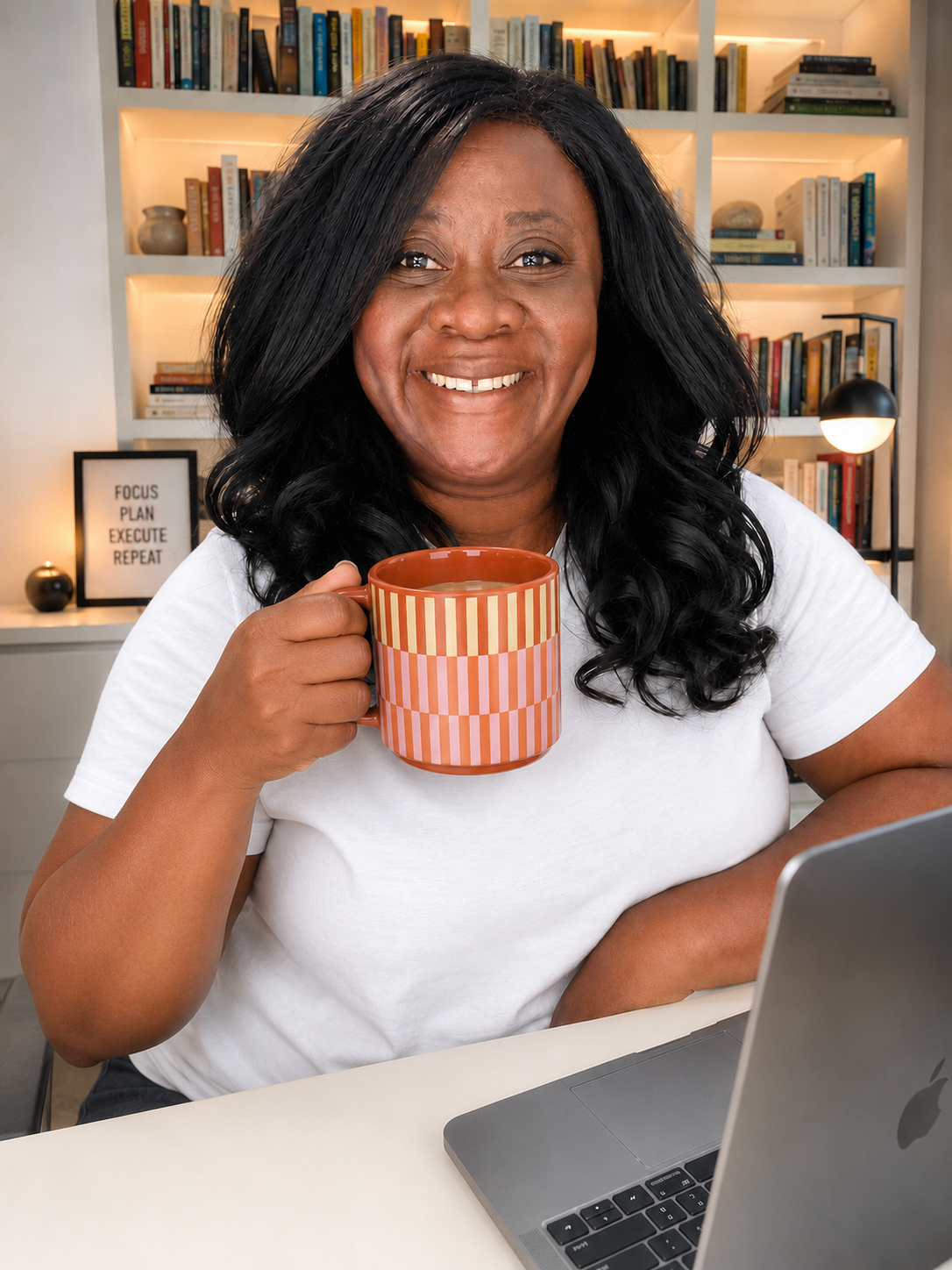 Marguerite smiling and holding a striped mug